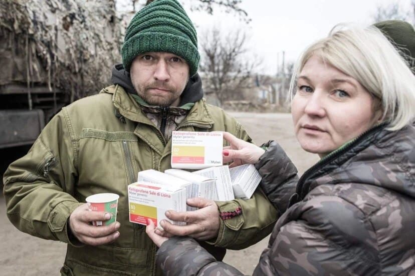 Natalka handing over boxes of medicine
